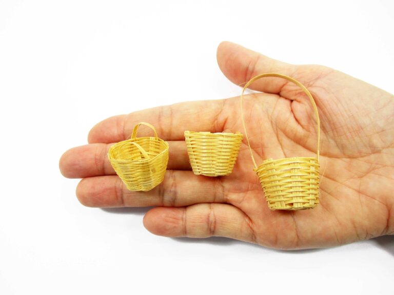 Handheld comparison of 1:12 scale miniature bamboo baskets including one handle, two handle, and no handle.