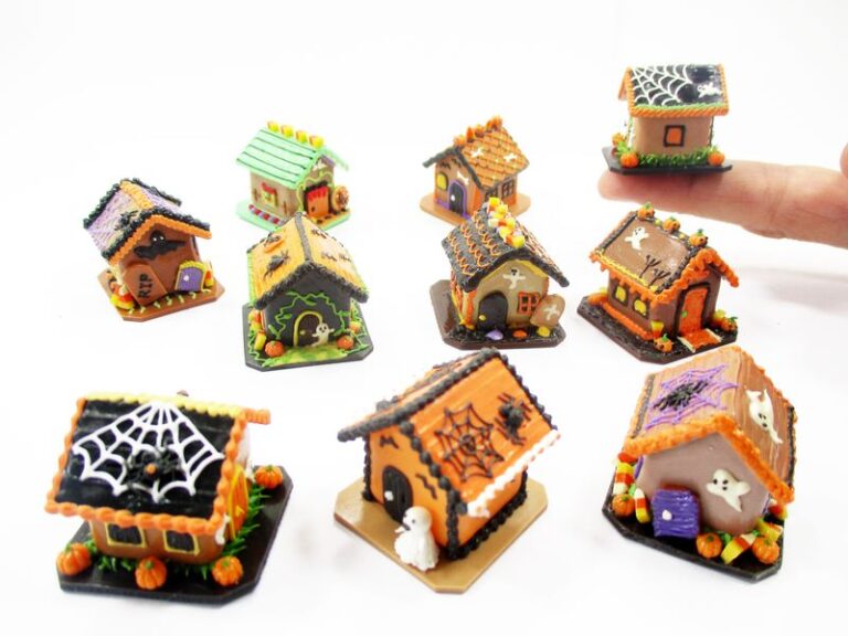 Group of ten different 1:12 scale miniature Halloween gingerbread houses in various spooky clay designs.